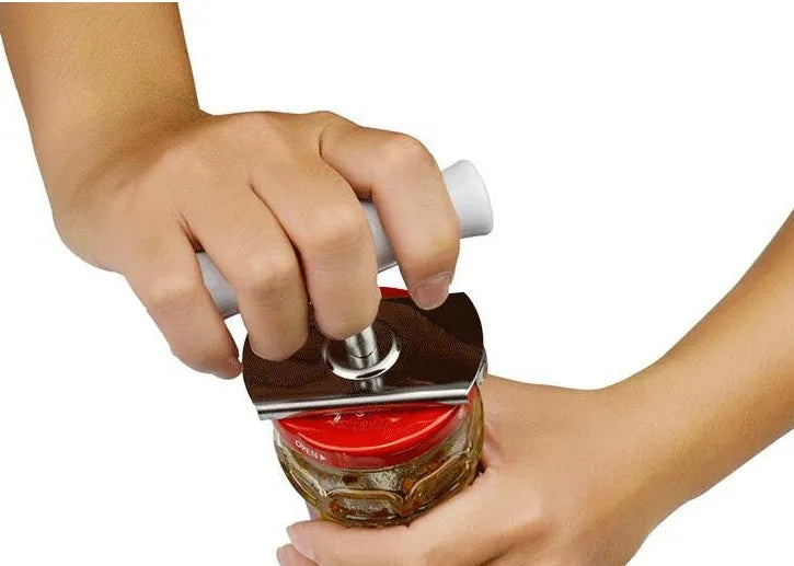 White adjustable stainless steel bottle opener with gear design and PP handle on a wooden surface.
