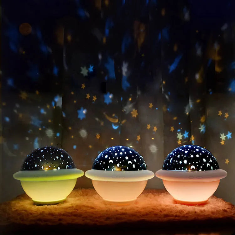 UFO-shaped starry sky projection night light in pink colour showing star projection effect