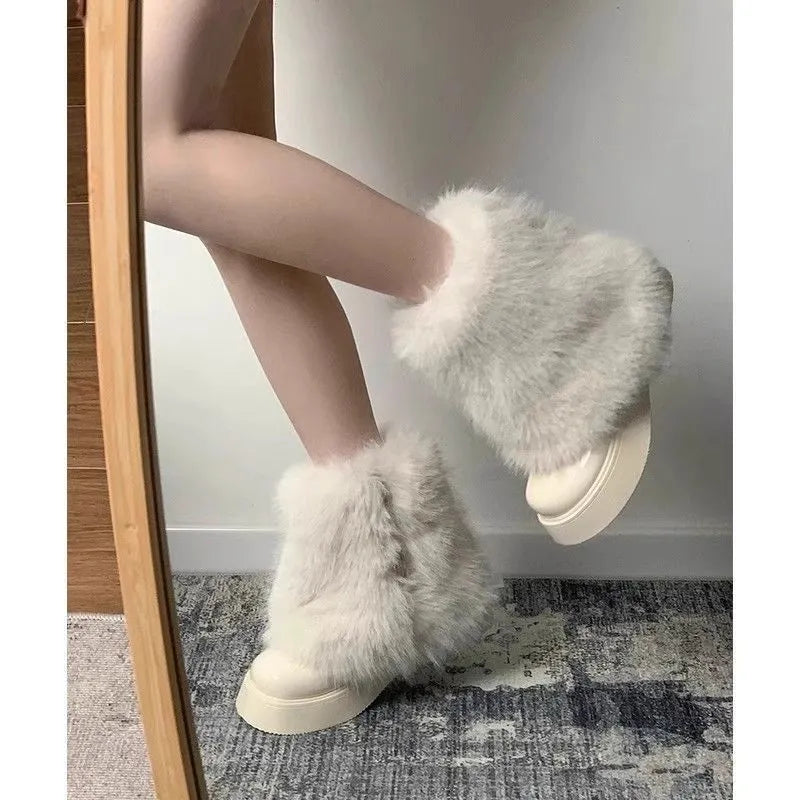 Women's black snow boots with fleece lining, waterproof platform, and rubber sole on a white background