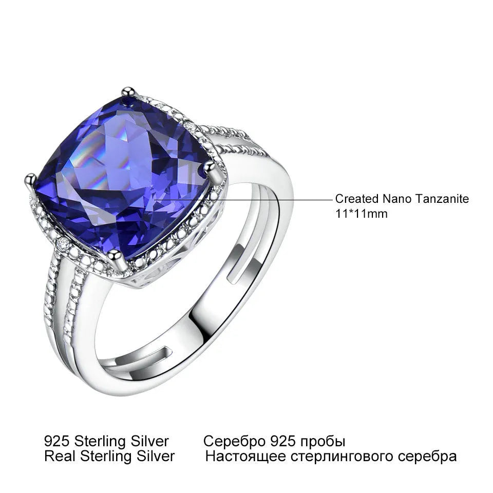 Close-up of a women's sterling silver ring with a blue tanzanite gemstone.