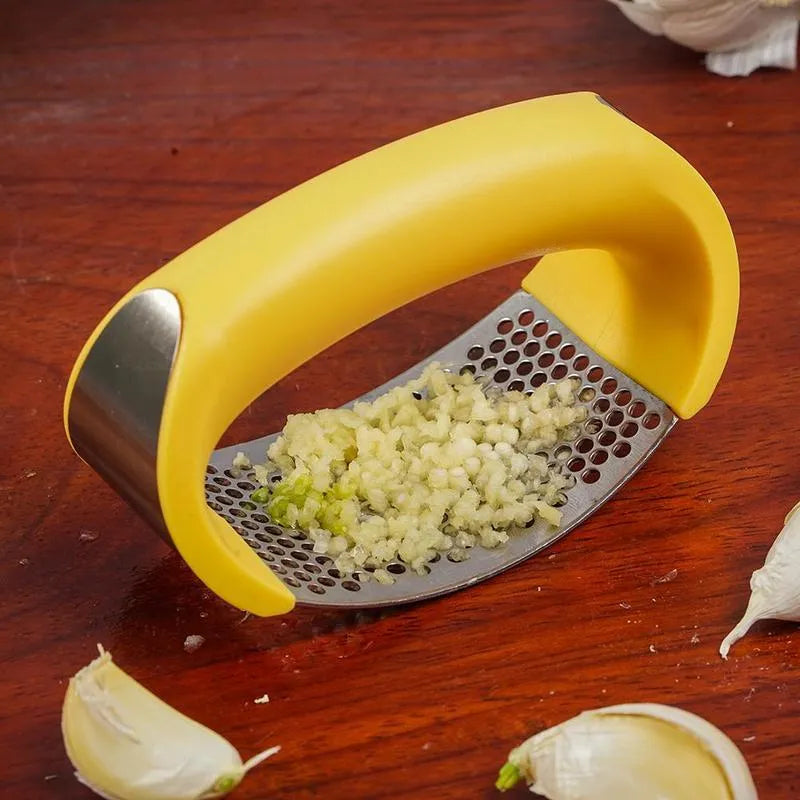 Stainless steel garlic press with ergonomic handle in available colours for kitchen use