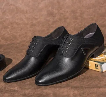 Men's black Oxford shoes with a low-profile artificial PU upper and rubber sole on a size chart.