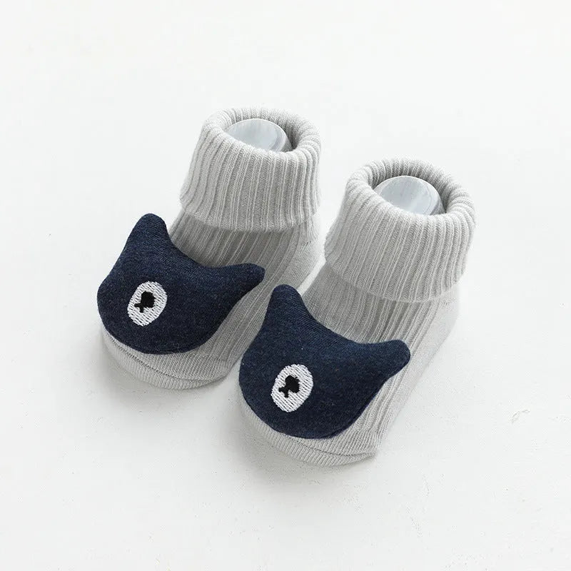 Baby socks with anti-slip glue dots on soles in combed cotton, showing mid-tube height and various colour options