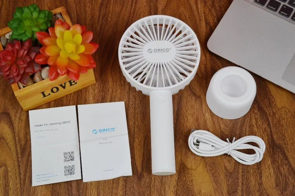 White ORICO FH1 rechargeable USB desktop and handheld fan showing fine line details on its ABS shell.