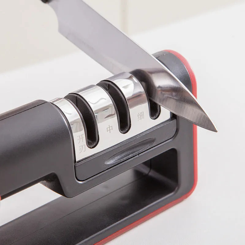 Black and red professional three-stage knife sharpener with non-skid rubber feet.