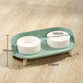 Green adjustable tilted double pet food bowl with spill-proof edges for cat and dog feeding
