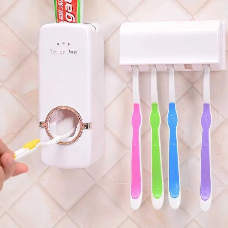 White wall-mounted bathroom set with a toothbrush holder and a pump-action toothpaste dispenser.
