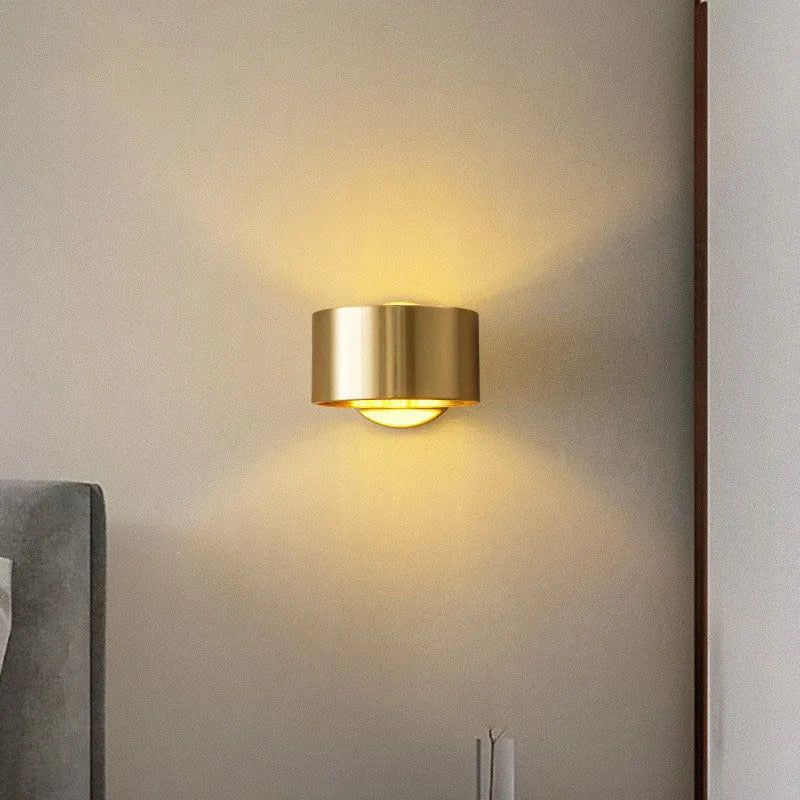 Modern simple copper wall lamp shown in gold and black finishes for living room use.