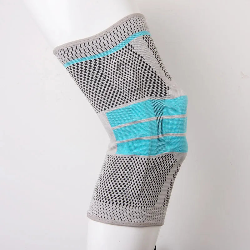 Sky blue elastic fibre knee pad with silicone grip for sports, shown in S, M, L, XL sizes.