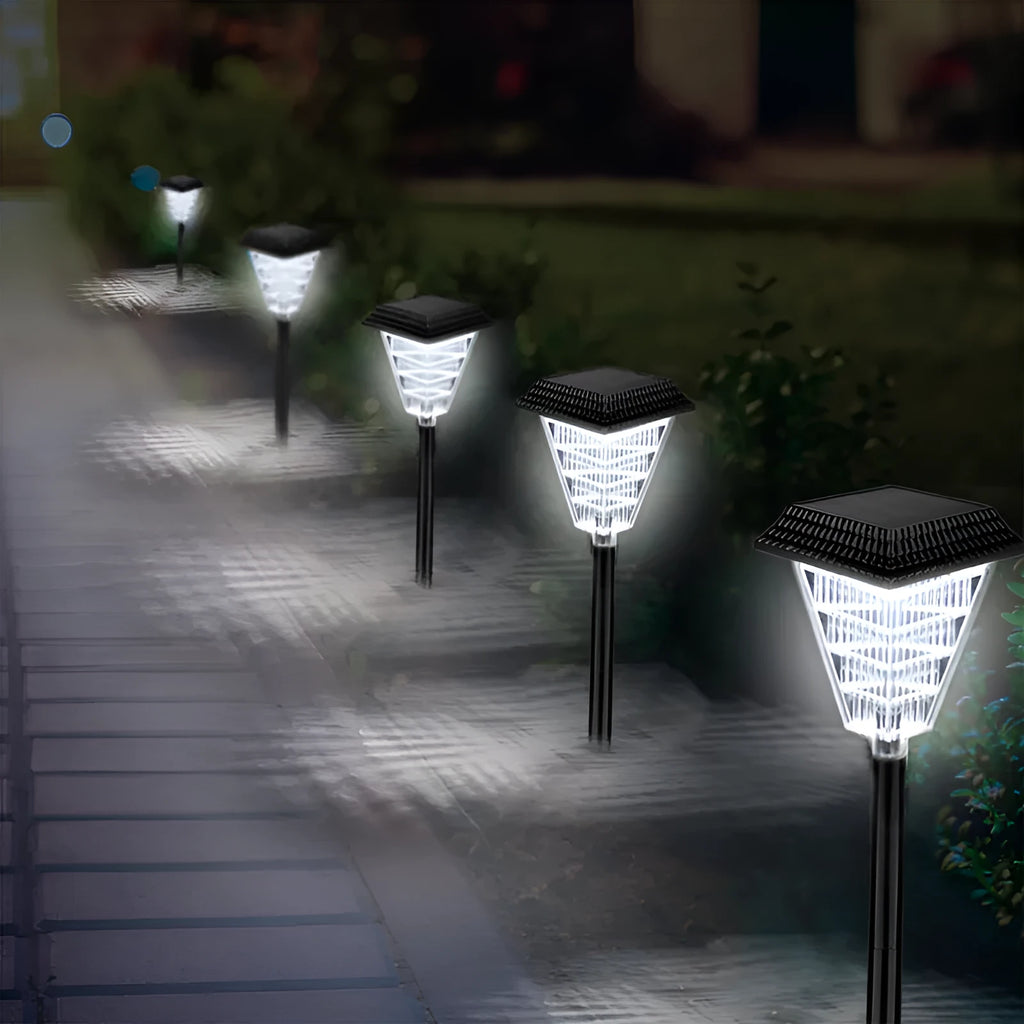 Solar garden light with colour changing LEDs in outdoor setting showing flame, green, red, and white light options