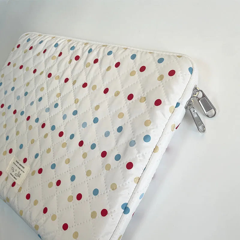 Women's polka dot polyester laptop bag shown in solid colour with size options for 11-inch to 15.6-inch laptops.