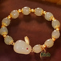 Green lucky jade hare bracelet for women with Chinese zodiac animal design and electroplated finish.