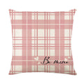 A square Valentine's Day cushion cover with a red and white plaid and heart print design.