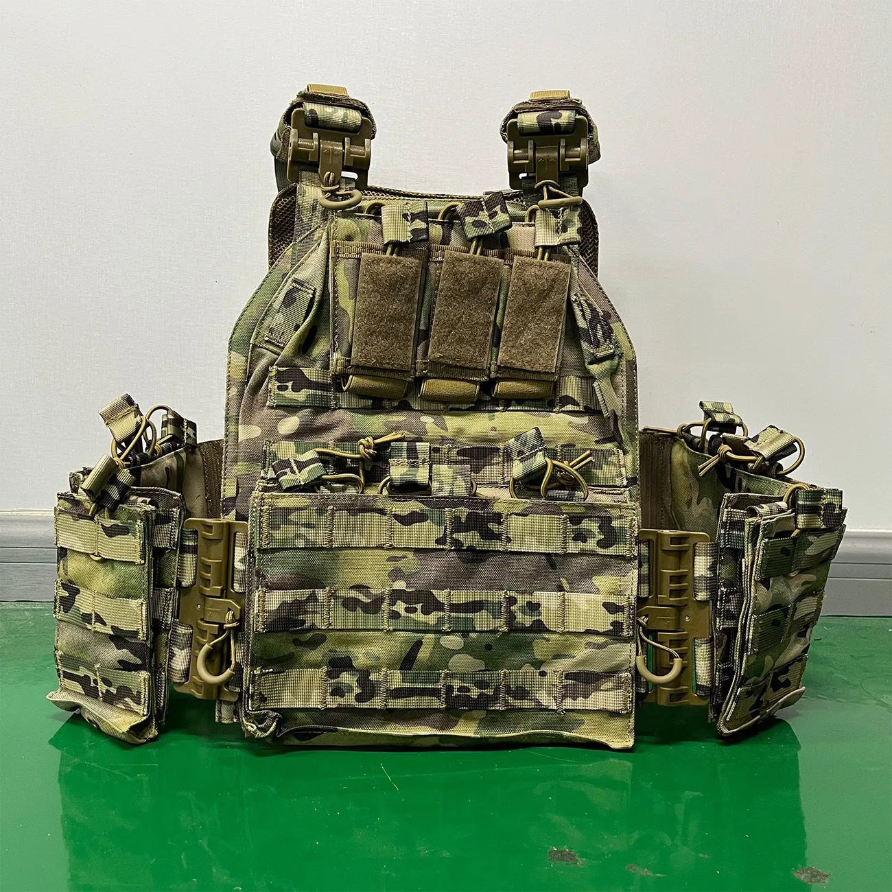 Solid colour Oxford cloth tactical vest in army green shown front view for outdoor use