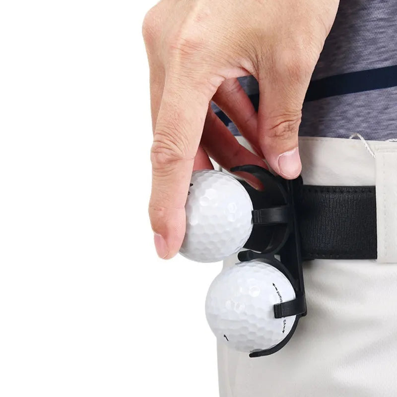 Black plastic golf ball holder clip for belt or bag, holds two golf balls, approx 8 x 4.2 x 1cm