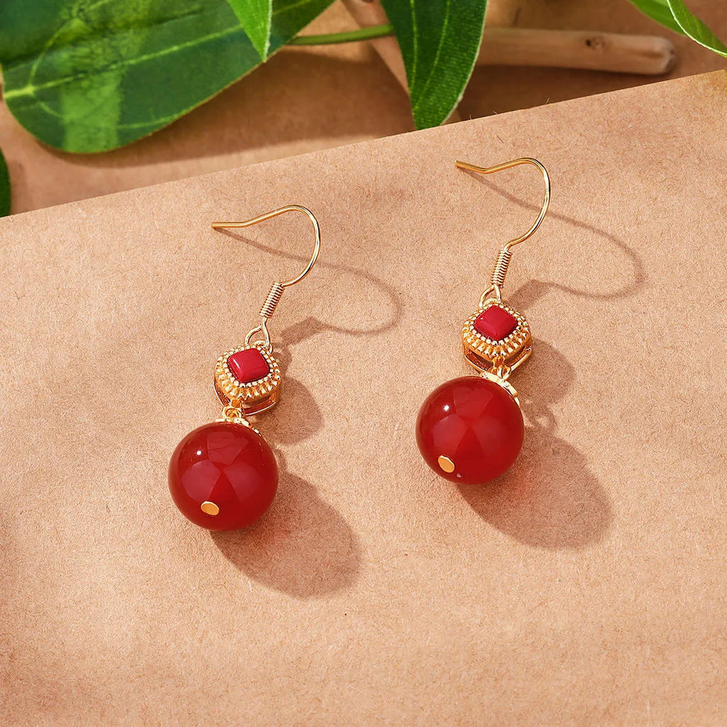 Geometric drop earrings with round Southern Red Agate beads and silver jasper inlay on an electroplated copper base.
