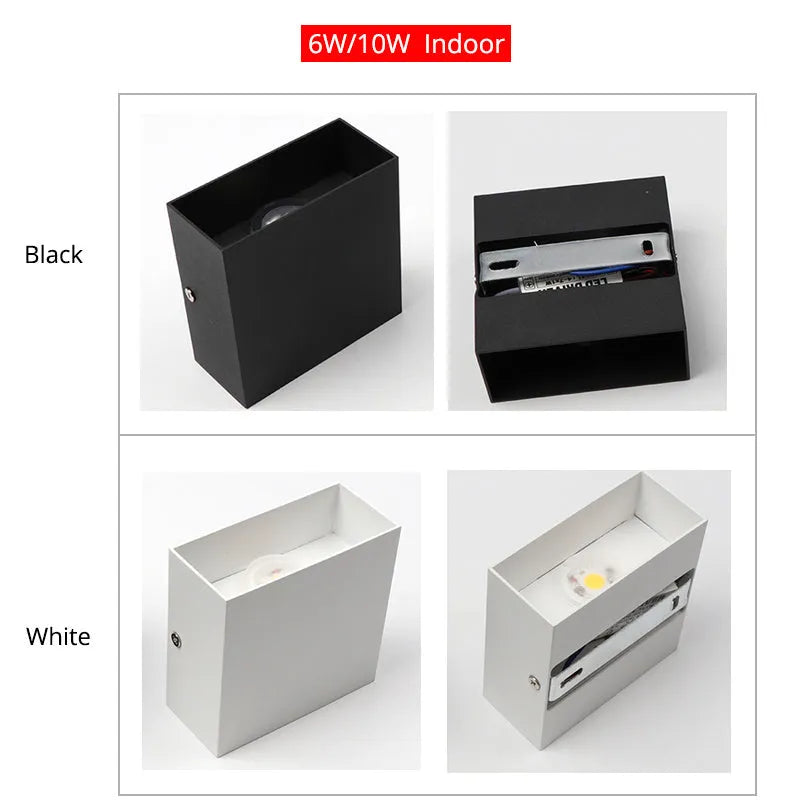 Square black aluminium wall lamp with 360-degree light output mounted on a corridor wall.