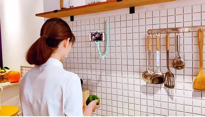 Flexible worm-style mobile phone holder with suction cup base showing 62cm reach and 360-degree rotation
