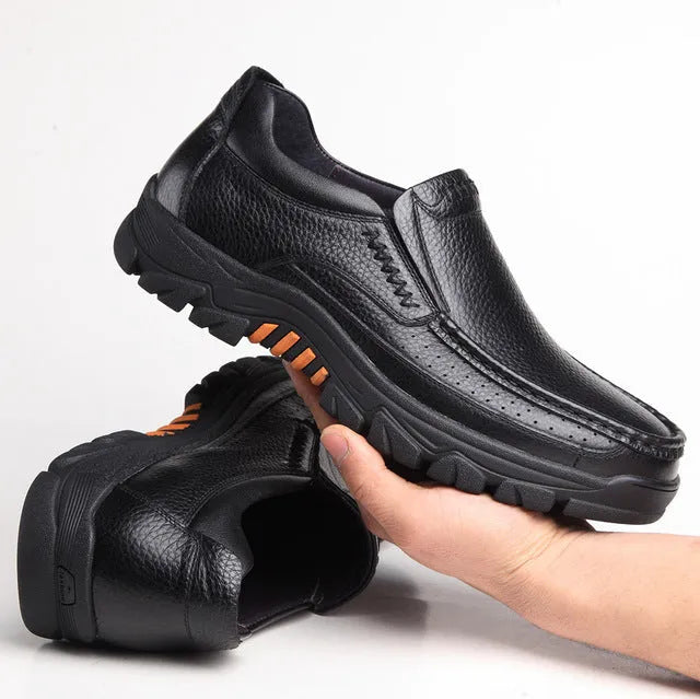 Men's black and brown cowhide leather slip-on business casual shoes with a rubber sole.
