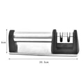 A black manual kitchen knife sharpener made from ABS plastic with an integrated handle.