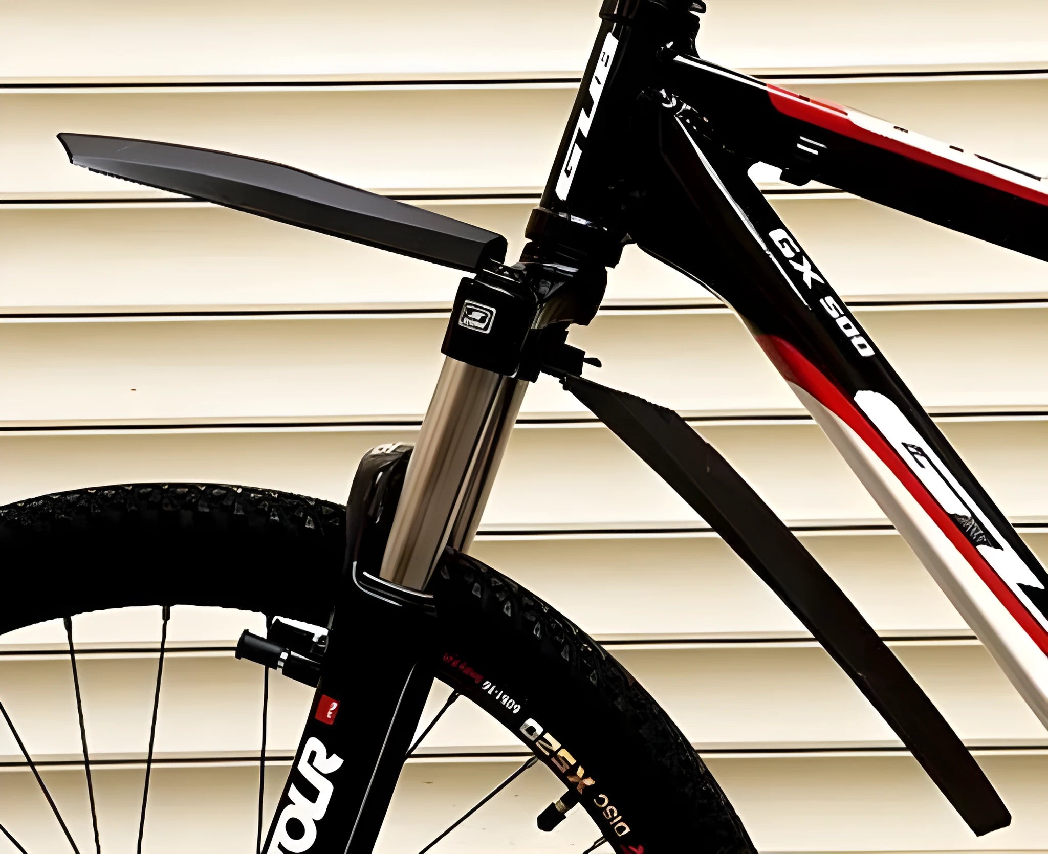 Plastic resin mountain bike fenders in black, blue, green, or red with quick release mechanisms