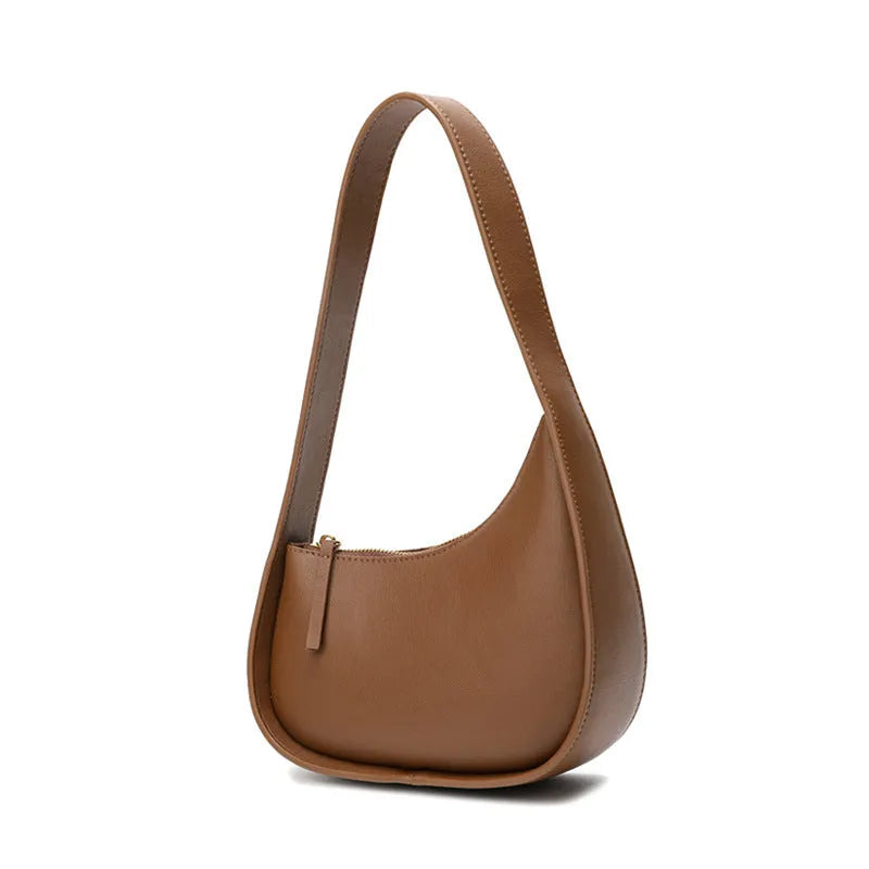 Genuine leather half moon shaped women's shoulder bag with wide strap in caramel colour