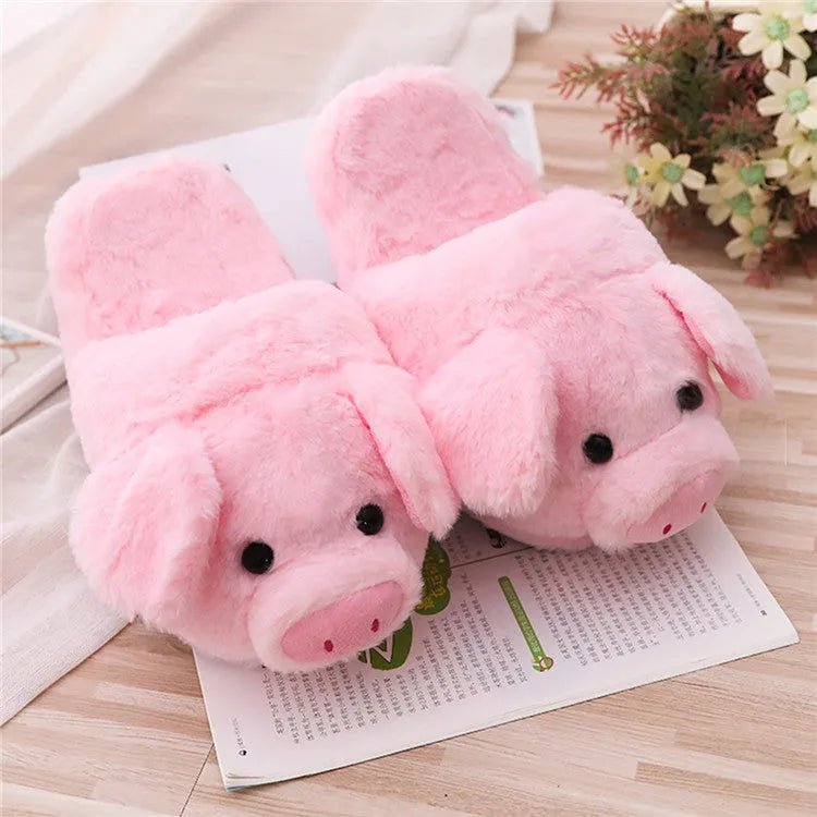 Pink pig-themed plush floor slippers for adults on a white background