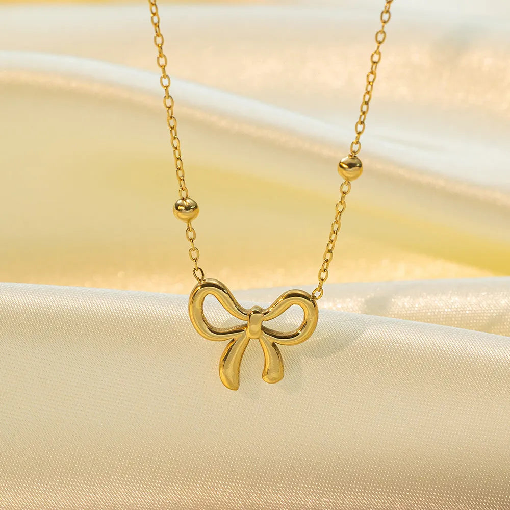 Gold bow necklace on cross chain with 41-50cm perimeter for women's office fashion