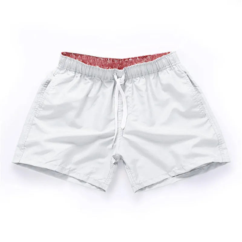 Men's straight leg beach shorts in polyester fabric available in multiple colours and sizes