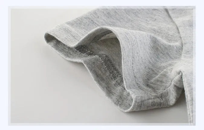 Grey children's cotton T-shirt shown with a size chart listing measurements from 90cm to 140cm.