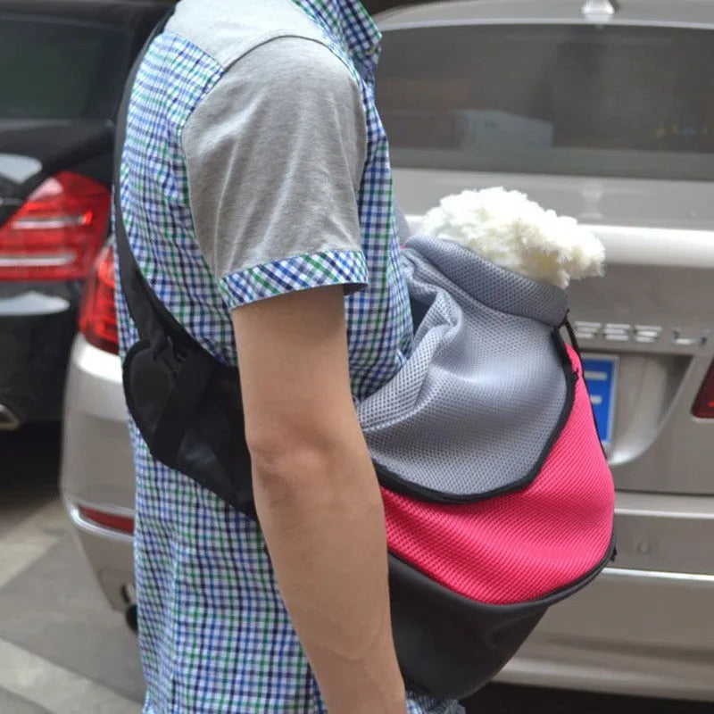 Polyester pet backpack carrier for a small dog, showing clear PVC front panel and adjustable shoulder straps.