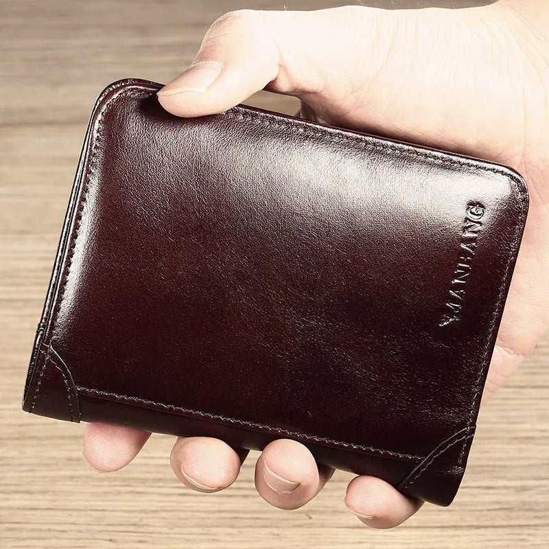 Men's black leather wallet open, showing internal card slots, photo slot, change pocket and hidden compartment.