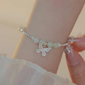 Women's Hetian jade bracelet and necklace set with silver butterfly charms on electroplated copper