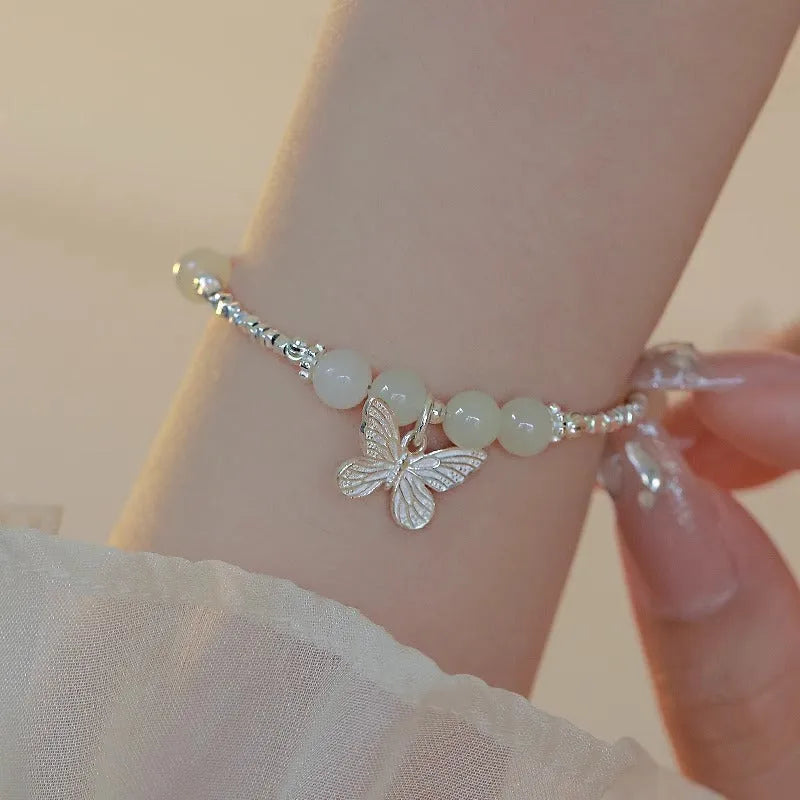 Women's Hetian jade bracelet and necklace set with silver butterfly charms on electroplated copper