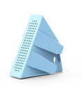 Portable black ABS mobile phone amplifier bracket holding an iPhone on a desk