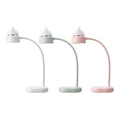 White rechargeable LED clip desk lamp with touch control on wooden desk