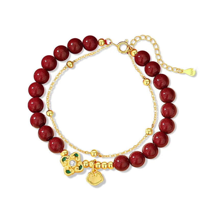 Sterling silver women's bracelet with geometric Ruyi and Xiangyun Chinese motifs and cinnabar red flower detailing