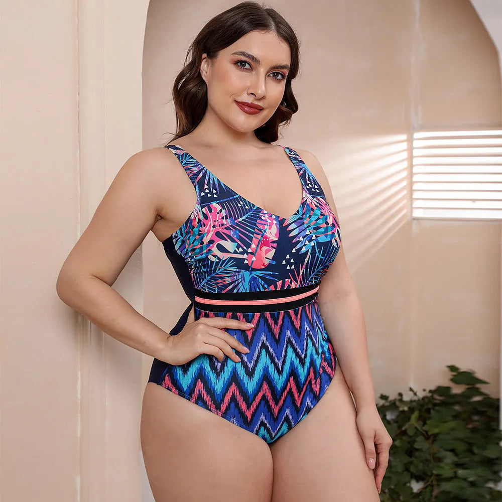 Women's blue printed one-piece swimsuit with spaghetti straps and a striped vest design on a mannequin.