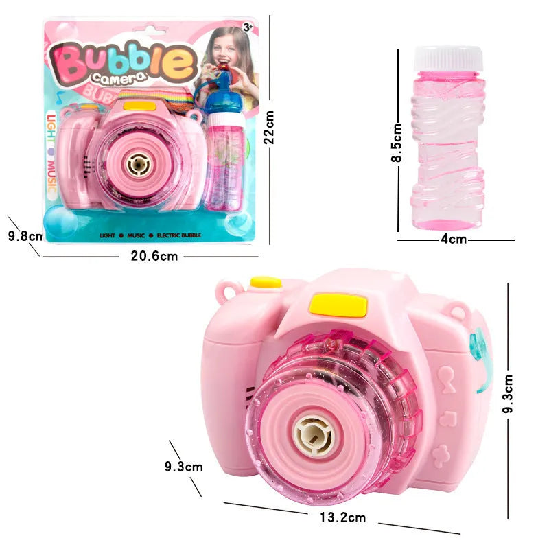 Yellow automatic camera-shaped bubble machine for children on a green lawn, producing soap bubbles.