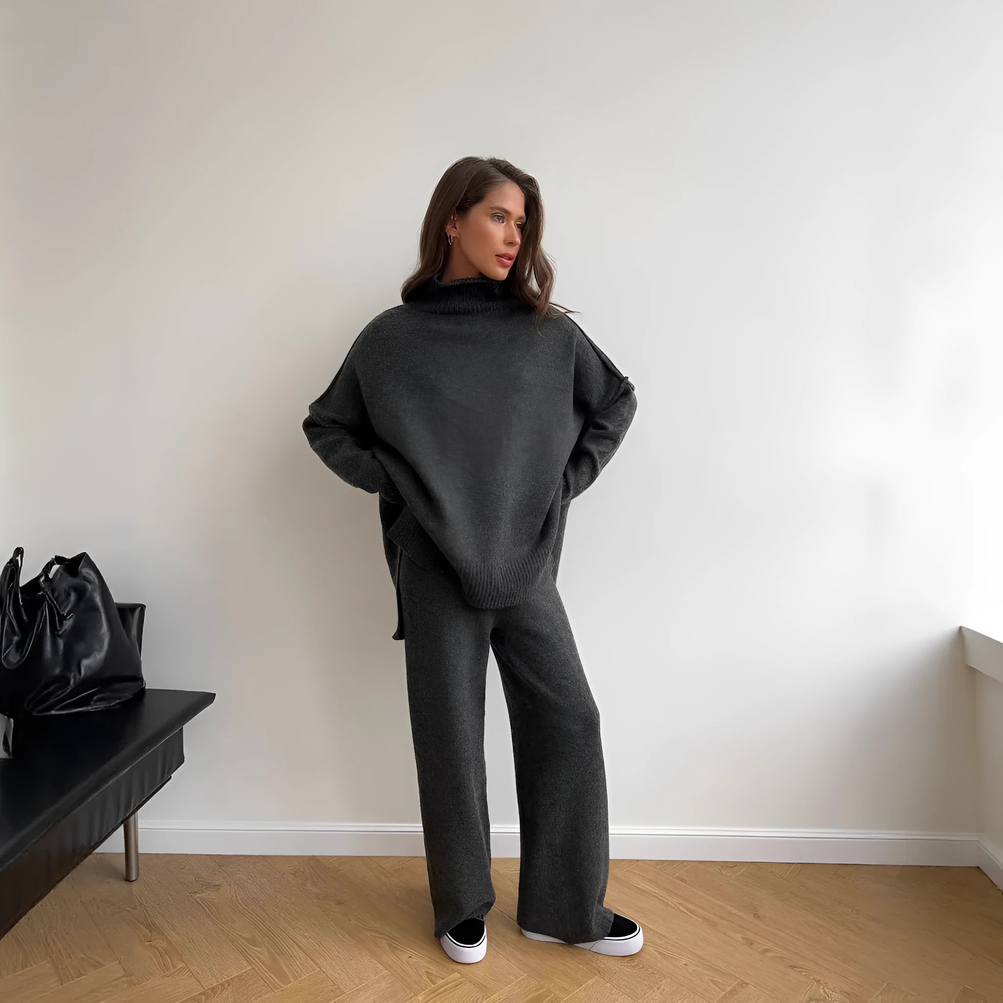 Women's grey side-slit acrylic sweater and matching trousers suit set.