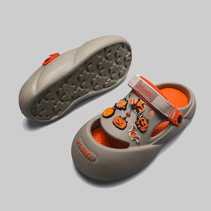 Men's grey EVA sole beach hole shoes on a sandy background
