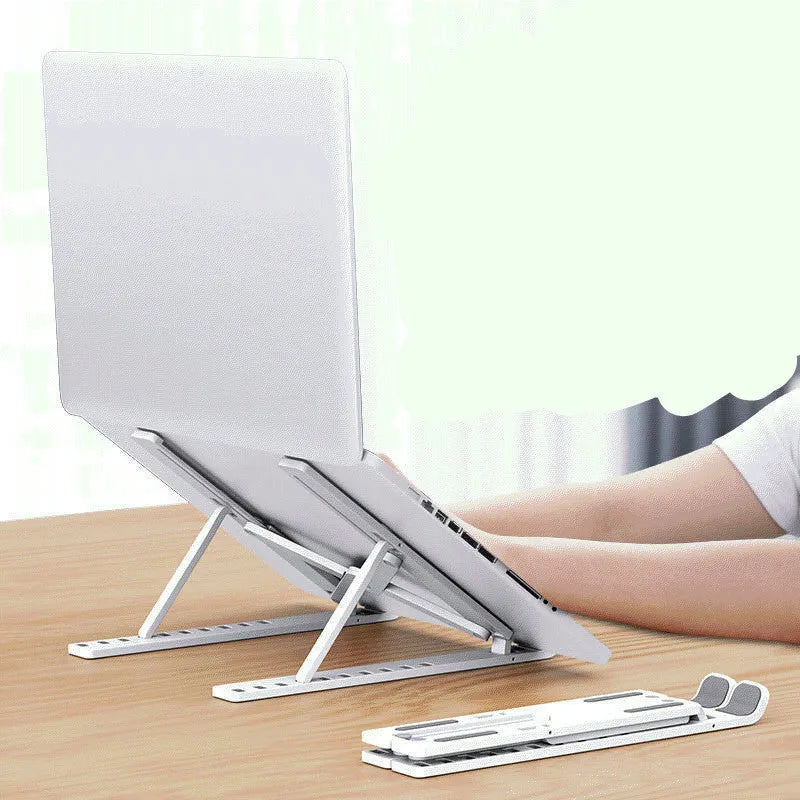 Black folding desktop bracket adjusted to a medium height angle on a wooden desk.