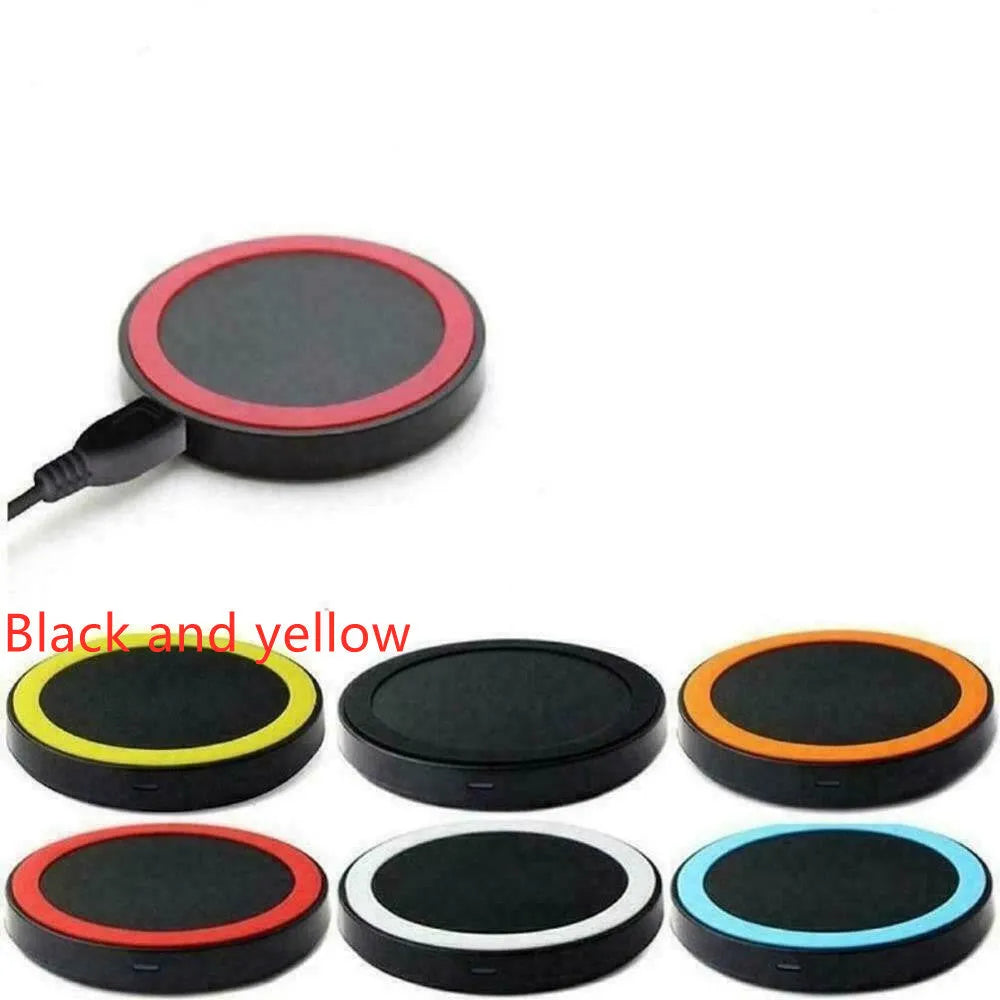 Compact round Qi wireless phone charger on a table in blue, next to a smartphone.
