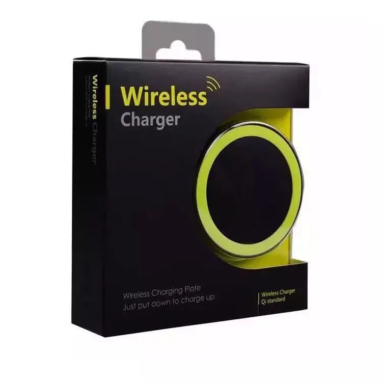Compact round Qi wireless phone charger on a table in blue, next to a smartphone.