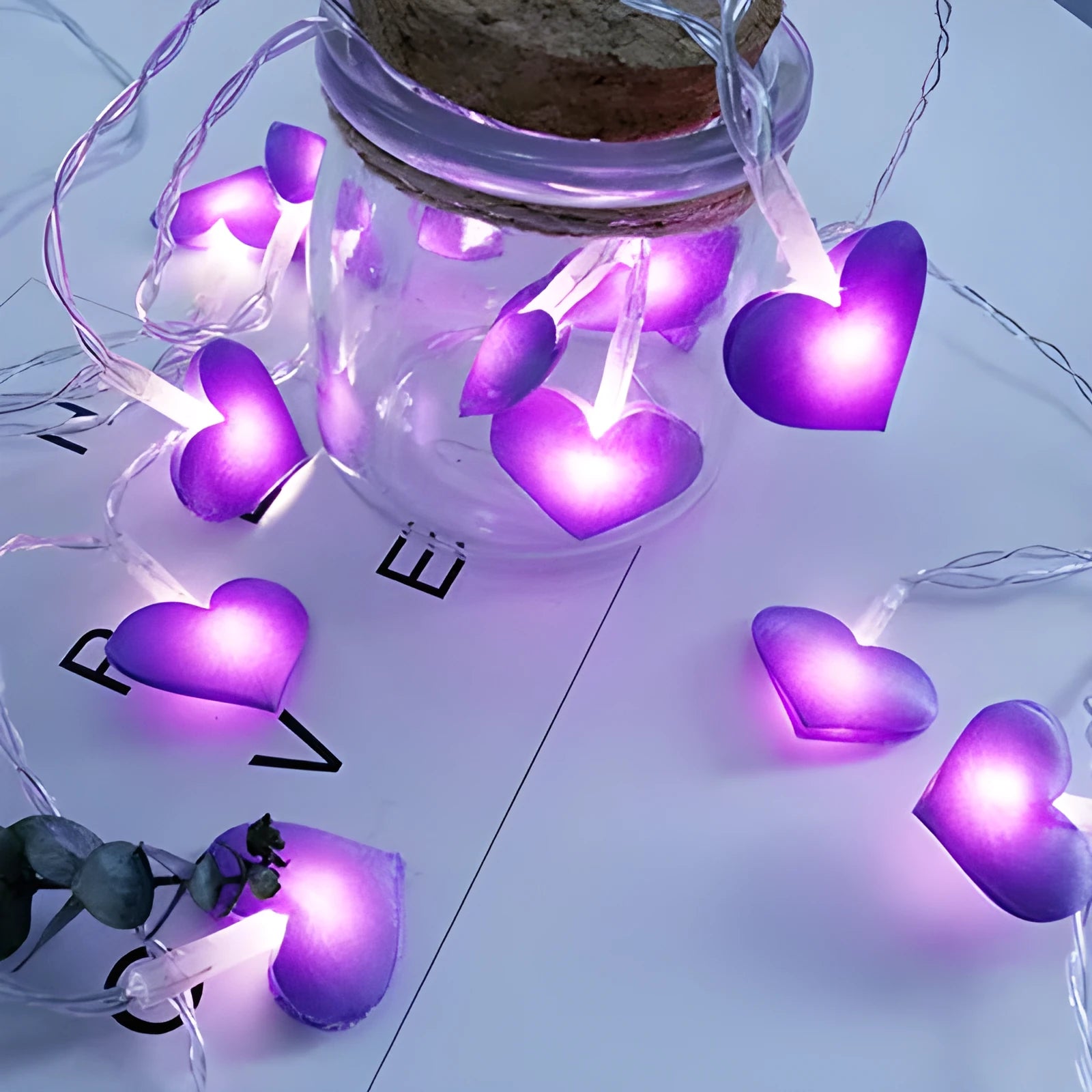 Pink and purple heart-shaped LED fairy lights hanging decoratively with 3-metre cable length