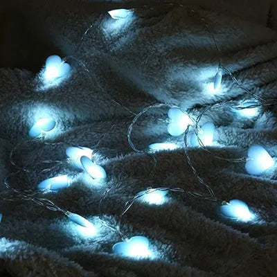 Pink and purple heart-shaped LED fairy lights hanging decoratively with 3-metre cable length