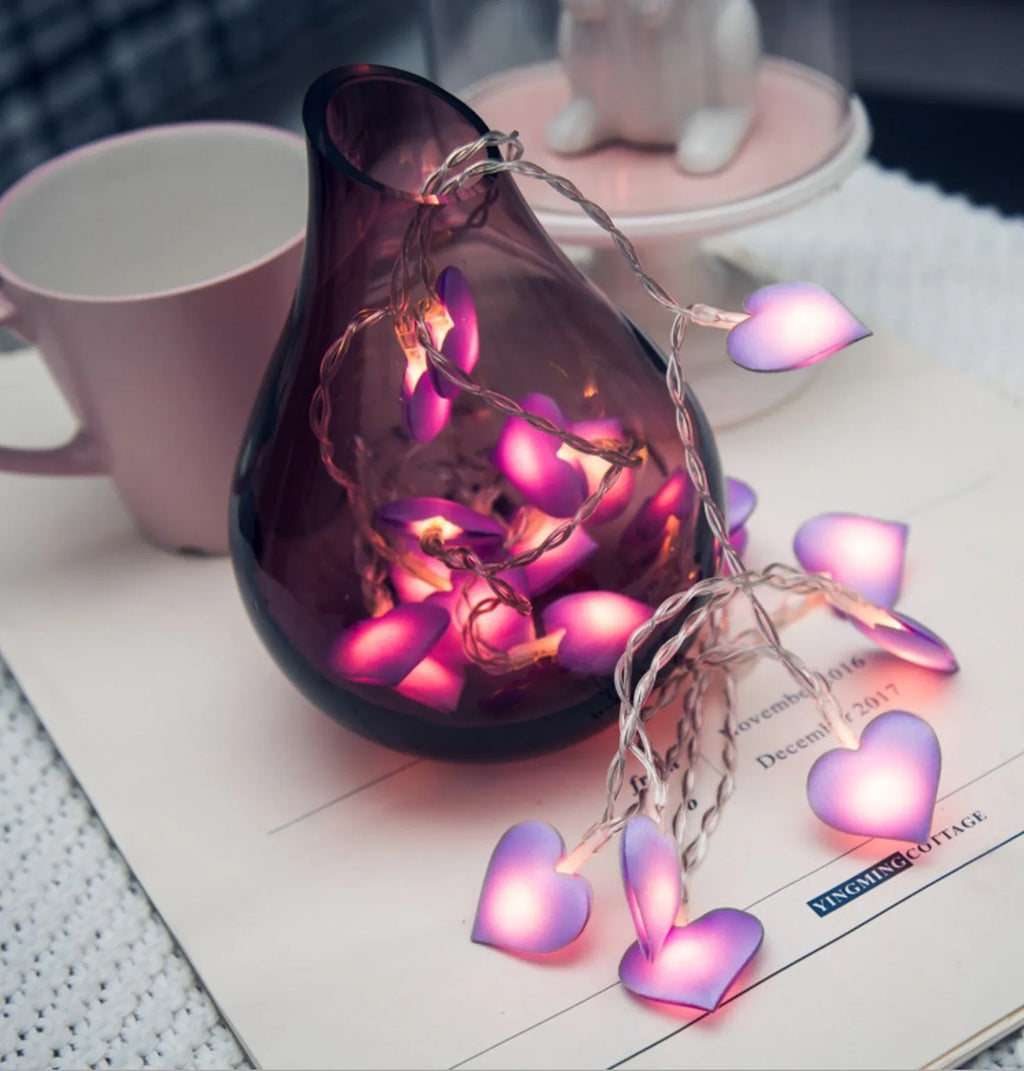 Pink and purple heart-shaped LED fairy lights hanging decoratively with 3-metre cable length