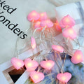 Pink and purple heart-shaped LED fairy lights hanging decoratively with 3-metre cable length