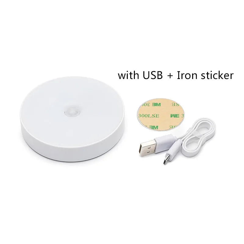 Small white circular motion sensing LED night light with USB charging port