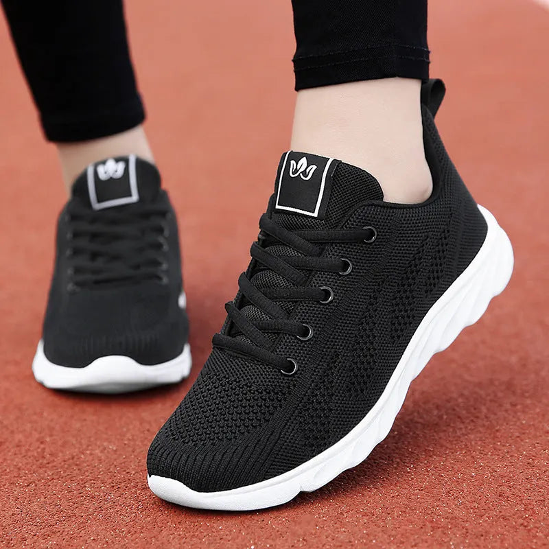 Women's black high-top casual shoe with back lacing and a flat EVA sole.